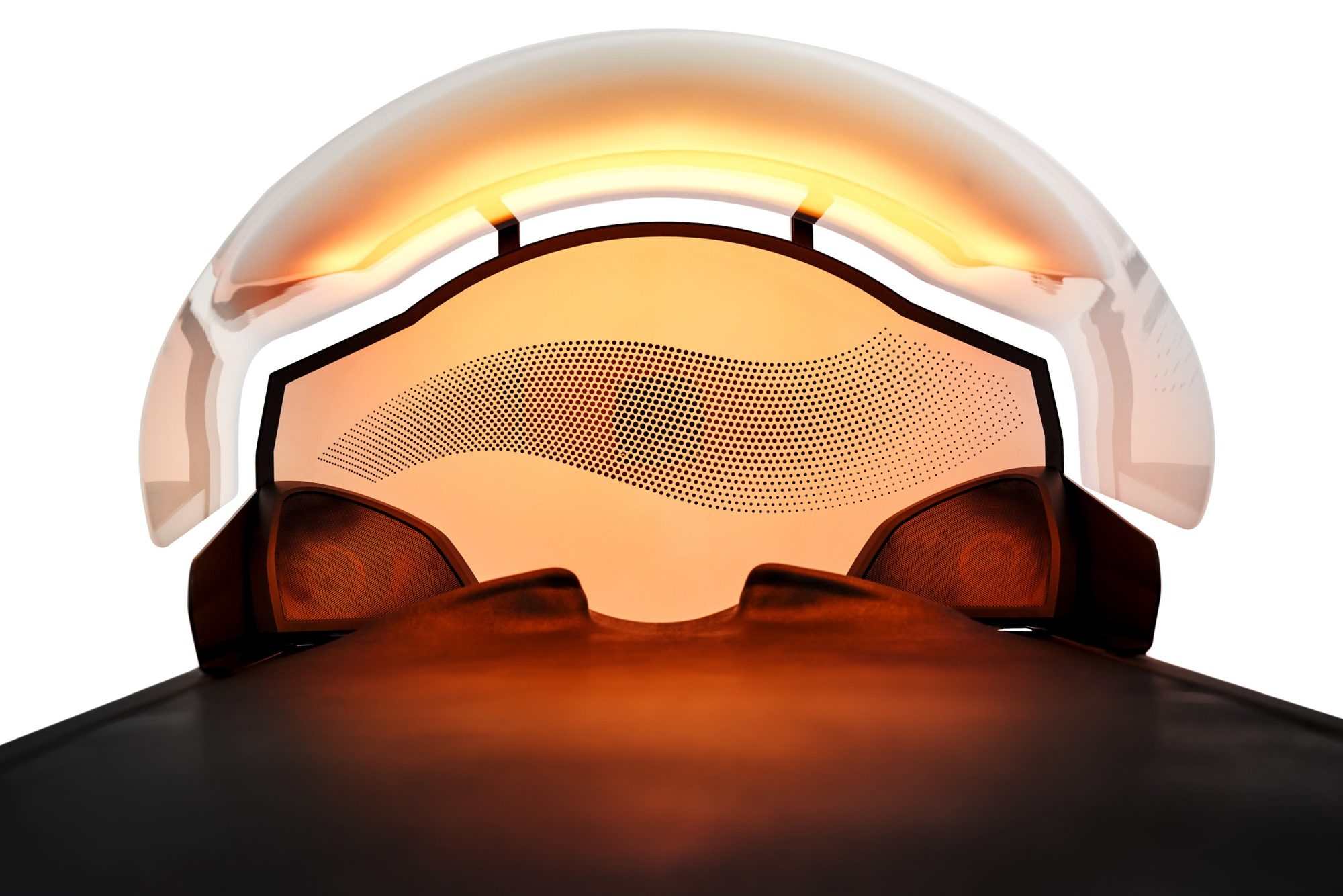 The HydroWave spa hood glowing warm orange above the head end of the bed